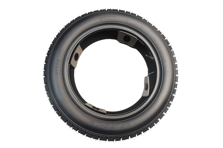 EMMO installed 125/65-12 scooter tire on alloy wheel featuring low-resistance surface design and wide contact patch ideal for urban paths and gentle park-road cruising in winter