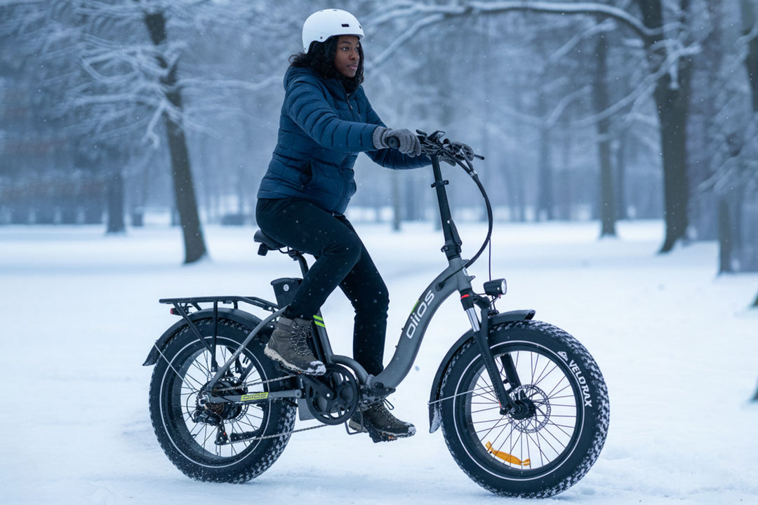 Oiios Electo Electric Bike  foldable ebike, step-thru frame, 20x4 fat tires, snow trail riding, winter terrain, Canada winter, strong grip, all season electric bike, compact folding frame, cold climate riding, outdoor adventure, stable handling, snowy roads, ebike commuting, fat tire traction