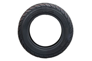 EMMO 130/70-12 rear wheel tubeless tire installed on electric moped showing wide contact patch, balanced rubber compound, and steady road contact for city and suburban use
