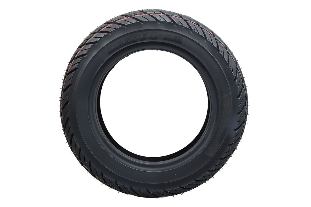 EMMO 130/70-12 rear wheel tubeless tire installed on electric moped showing wide contact patch, balanced rubber compound, and steady road contact for city and suburban use